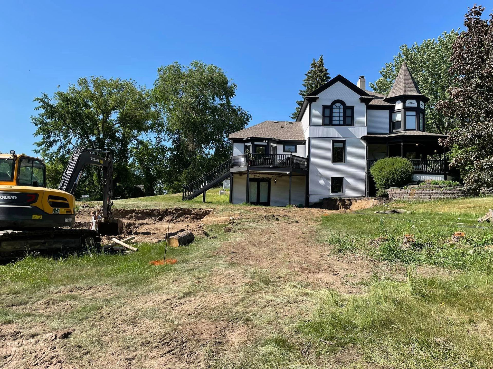 House with Heavy Equipment Beside — Shakopee, MN — Outdoor Oasis