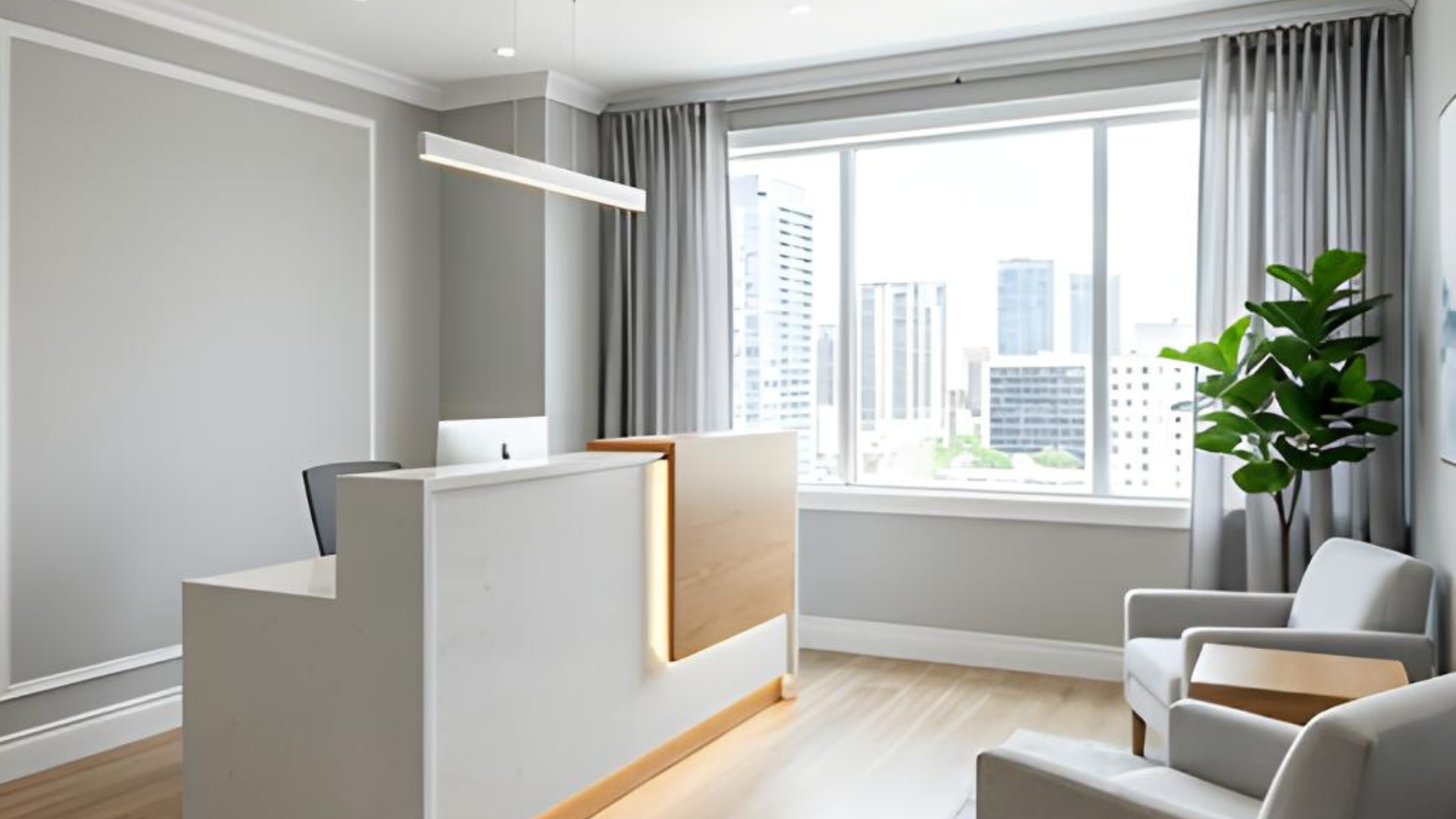 Modern minimalist office reception with gray chairs, a white desk, and a large city-view window