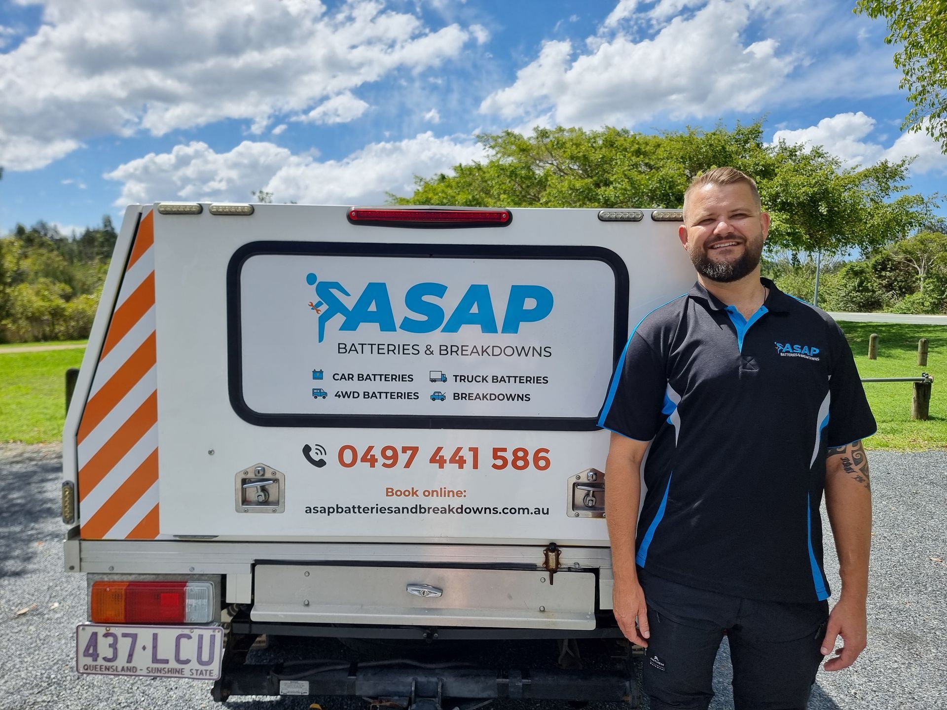 Man standing by a truck with 