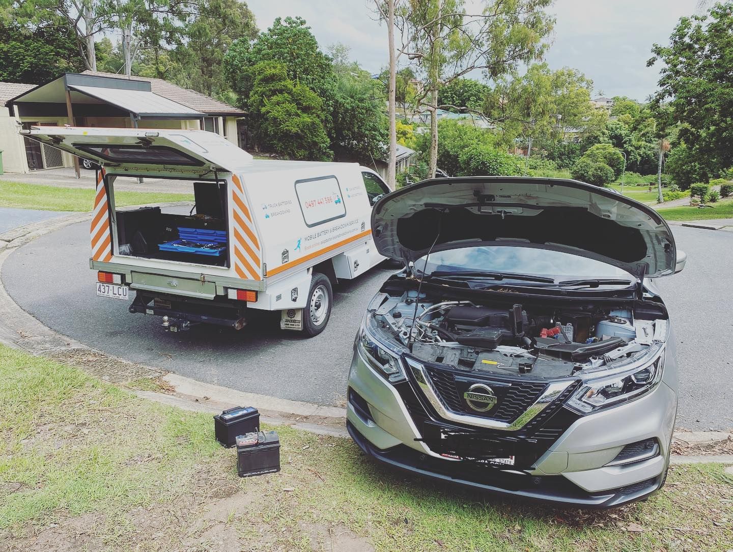 A Mobile Mechanic Van Parked Next to a Silver Nissan With Its Hood Open — ASAP Batteries & Breakdowns in Coomera, QLD