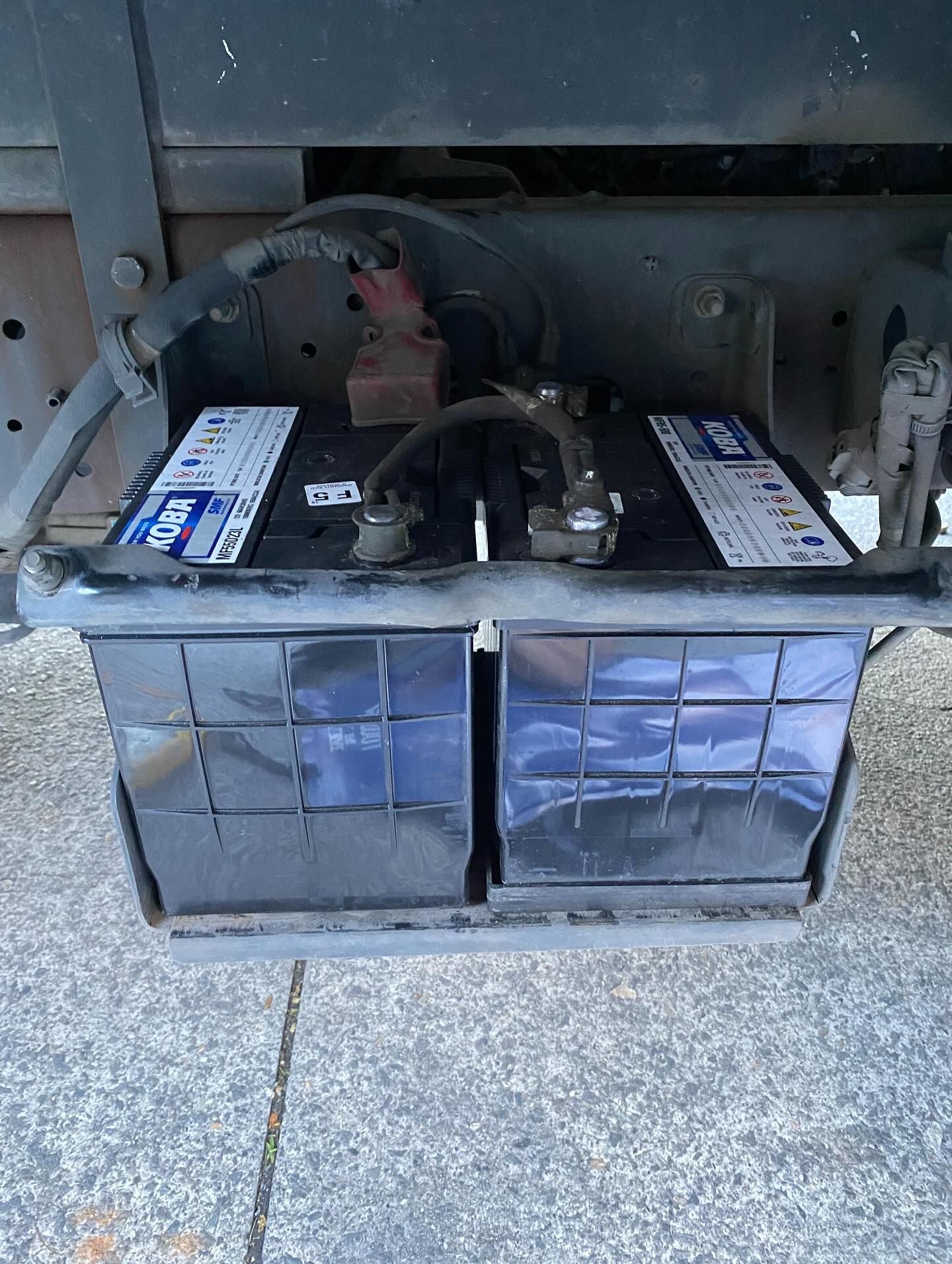 Two Black Batteries in a Protective Enclosure — ASAP Batteries & Breakdowns in Burleigh Heads, QLD