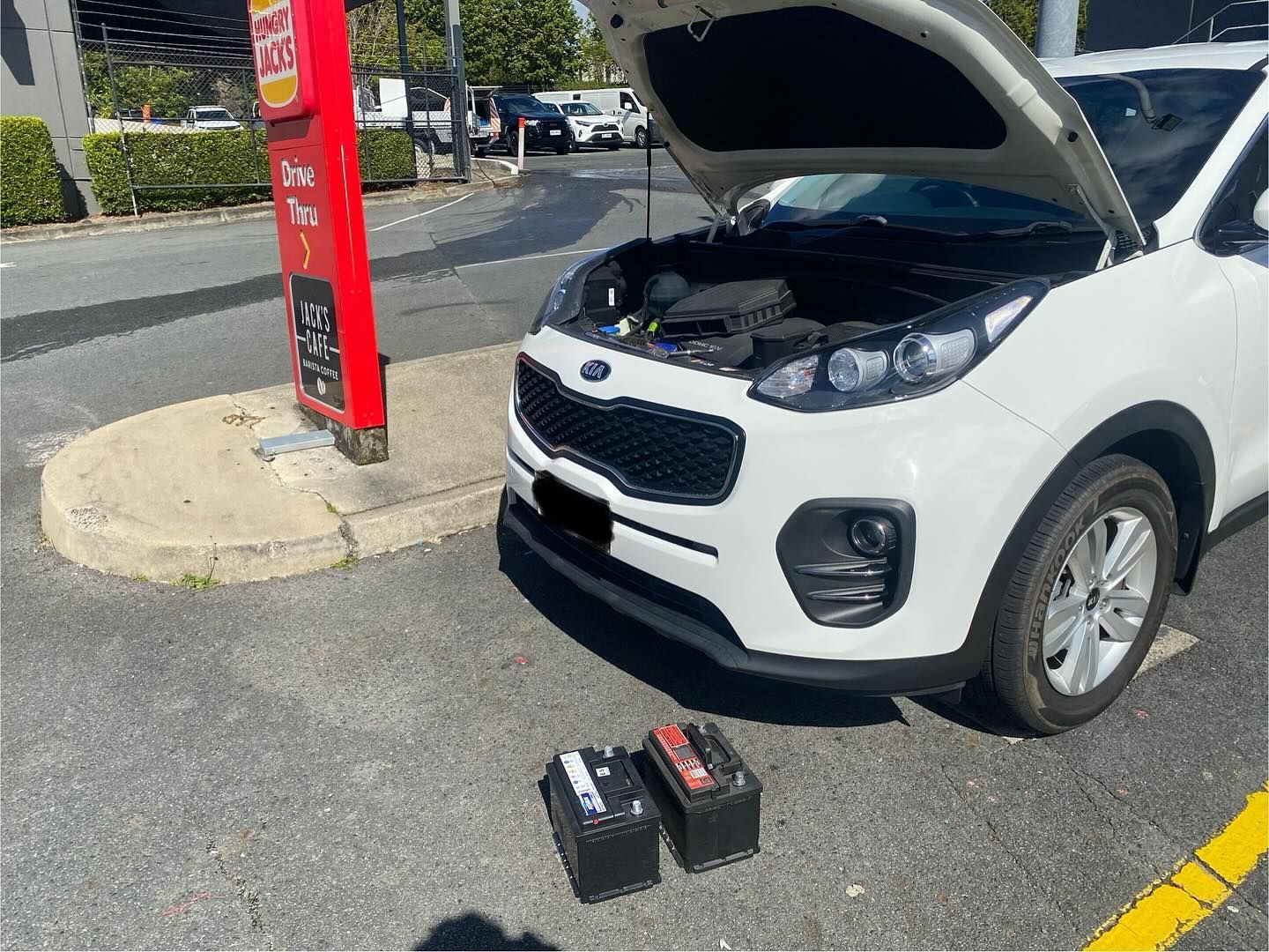 White Kia Sportage With Open Hood; Two Car Batteries — ASAP Batteries & Breakdowns in Burleigh Heads, QLD