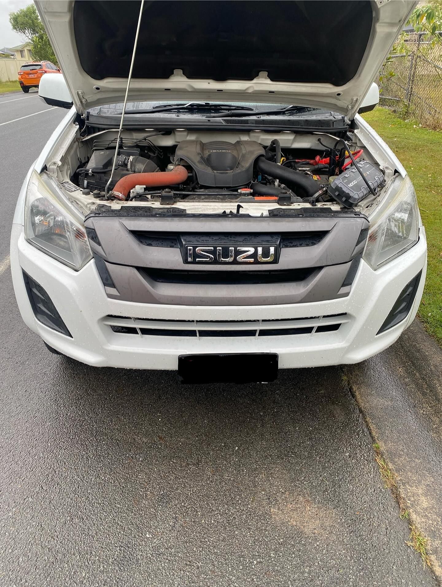 White Isuzu Truck With Open Hood — ASAP Batteries & Breakdowns in Burleigh Heads, QLD
