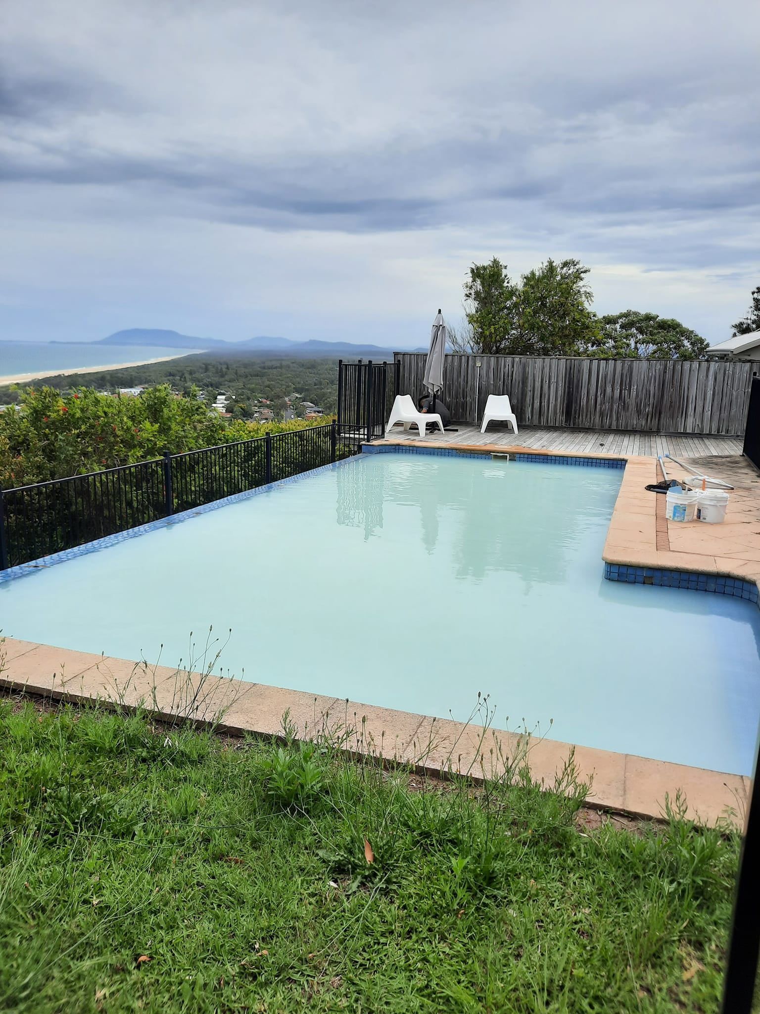 Swimming Pool Overlooking a Beach and Landscape Under Cloudy Skies — Donna's Pool & Spa Centre In Port