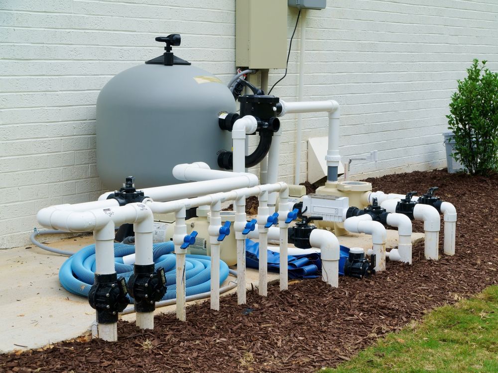 Pool Filtration System With Gray Tank, White Pipes — Donna's Pool & Spa Centre In Port