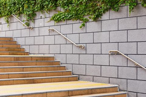 an outdoor stair with stainless steel railings