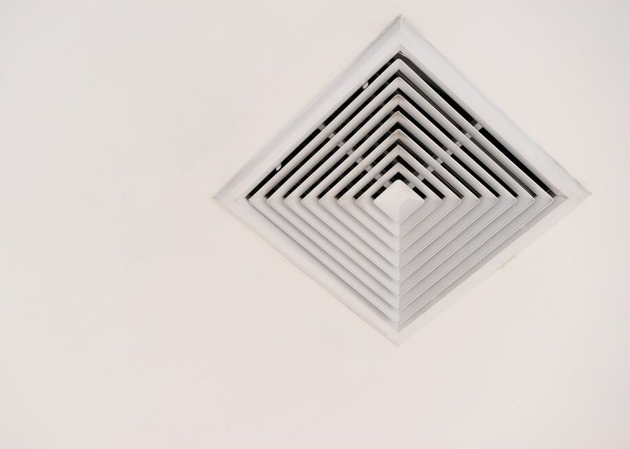A White Air Vent In The Shape Of A Diamond On A White Wall — Ramm Air Conditioning In Port Macquarie, NSW
