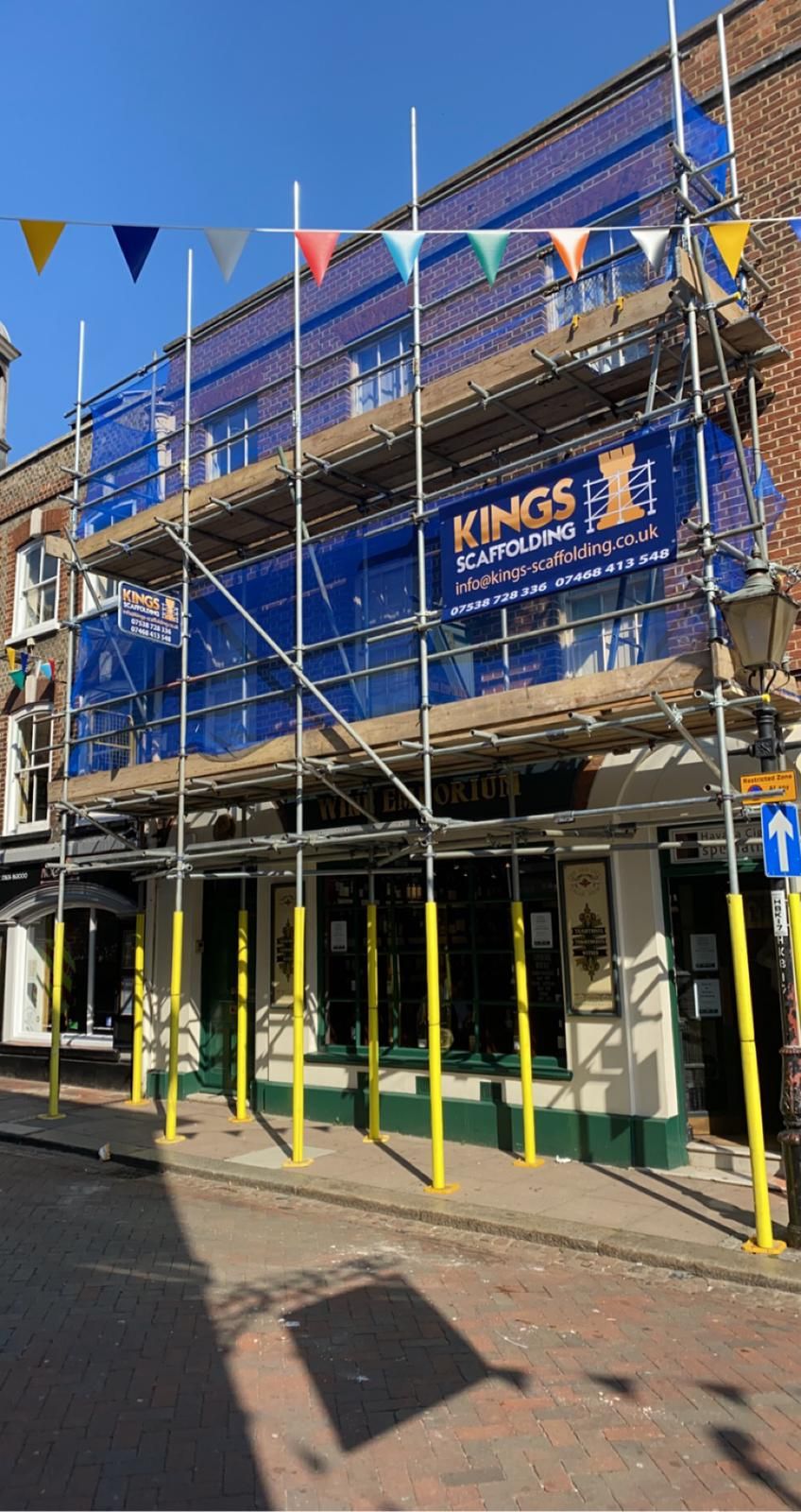 A building with scaffolding on the side of it.