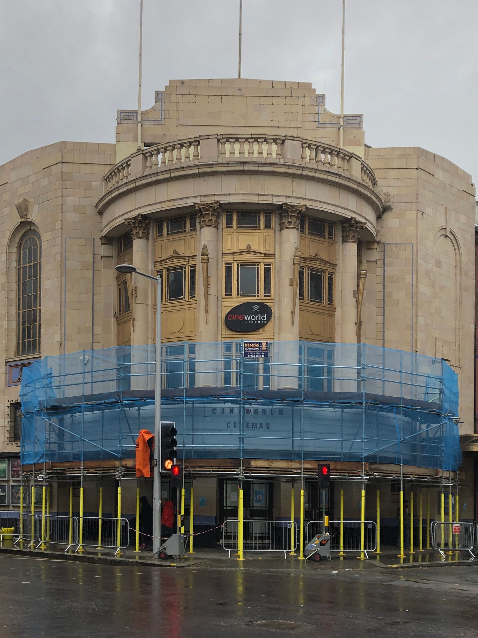 A large building with a blue scaffolding around it