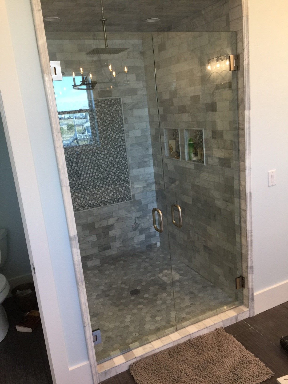 Frameless shower door 108