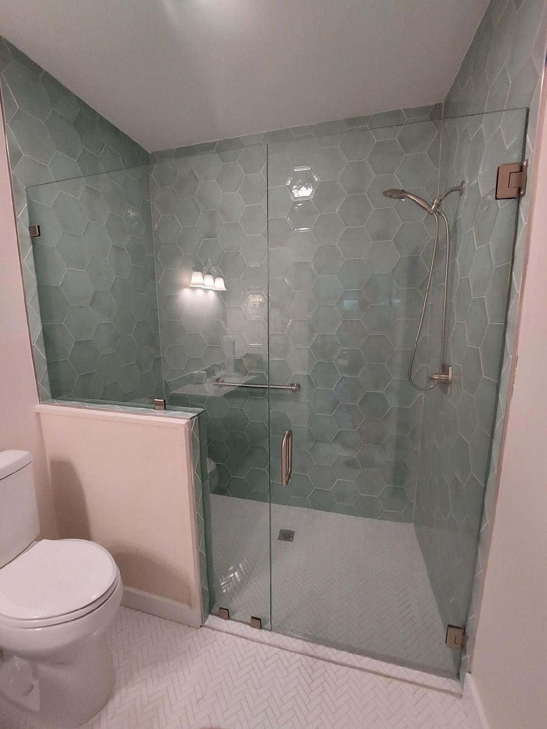 Frameless shower door 130