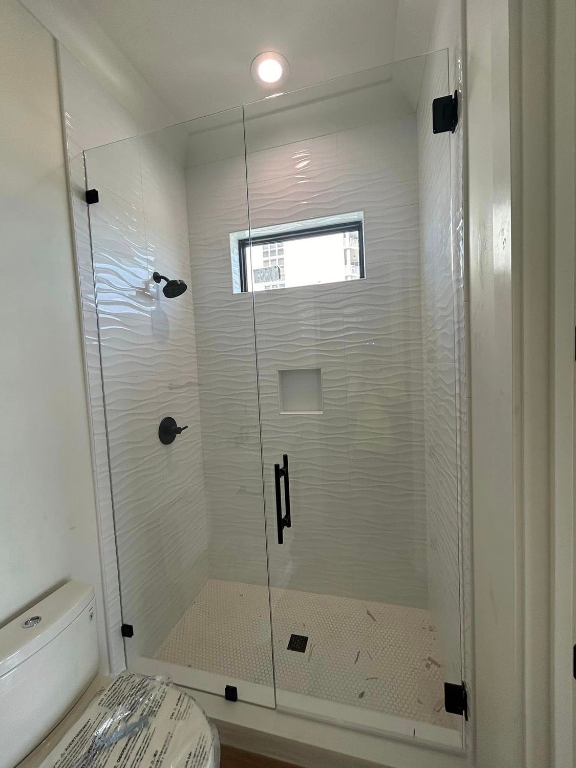Frameless shower door 106
