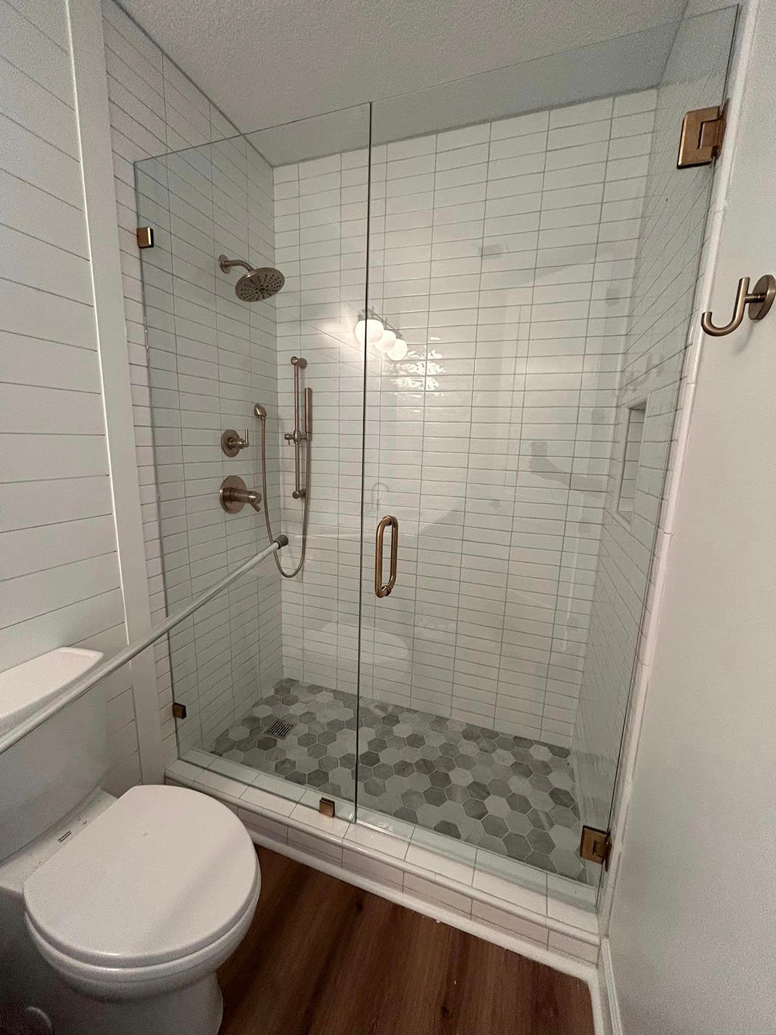 Frameless shower door 102