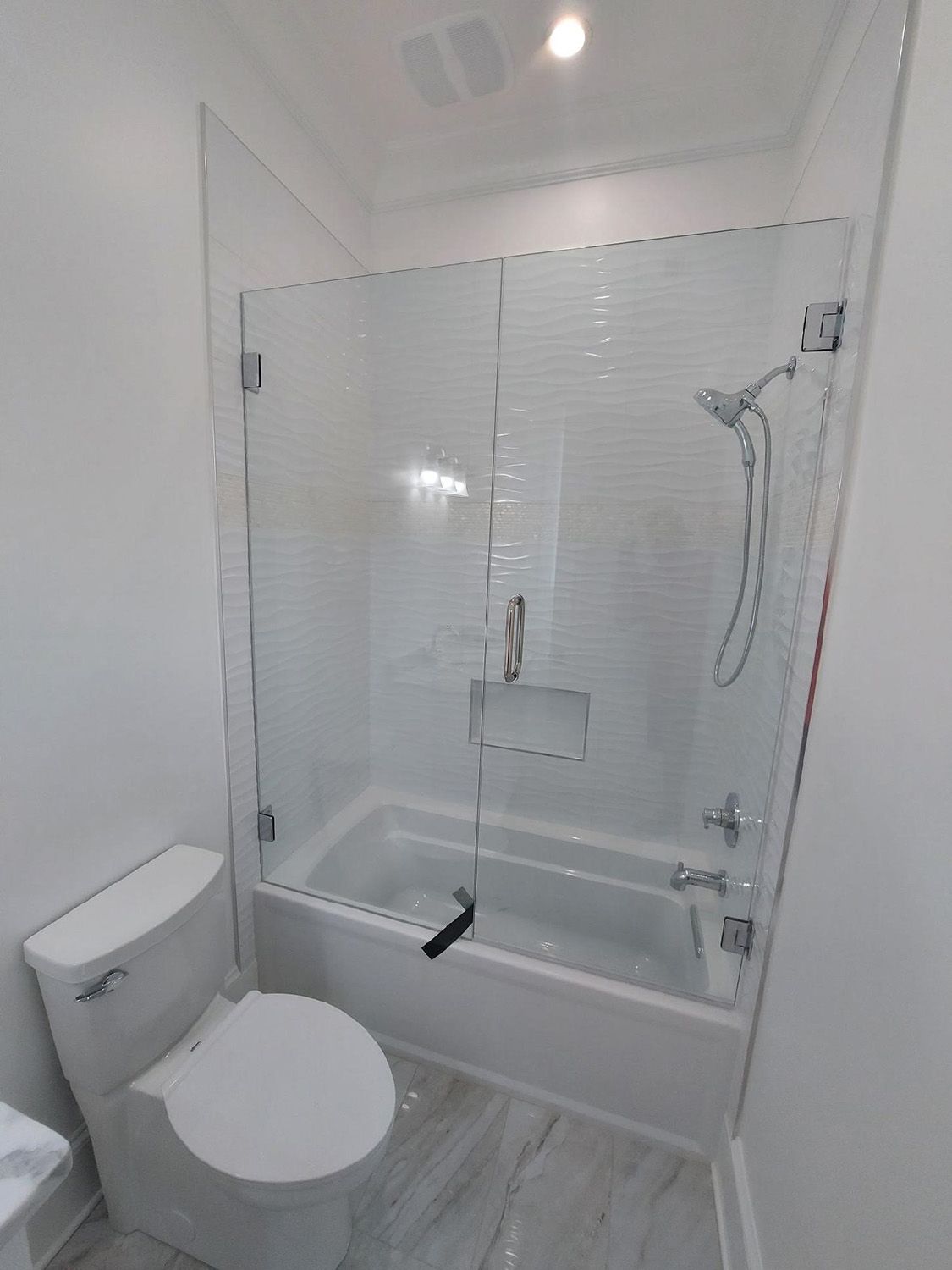 Frameless shower door 116