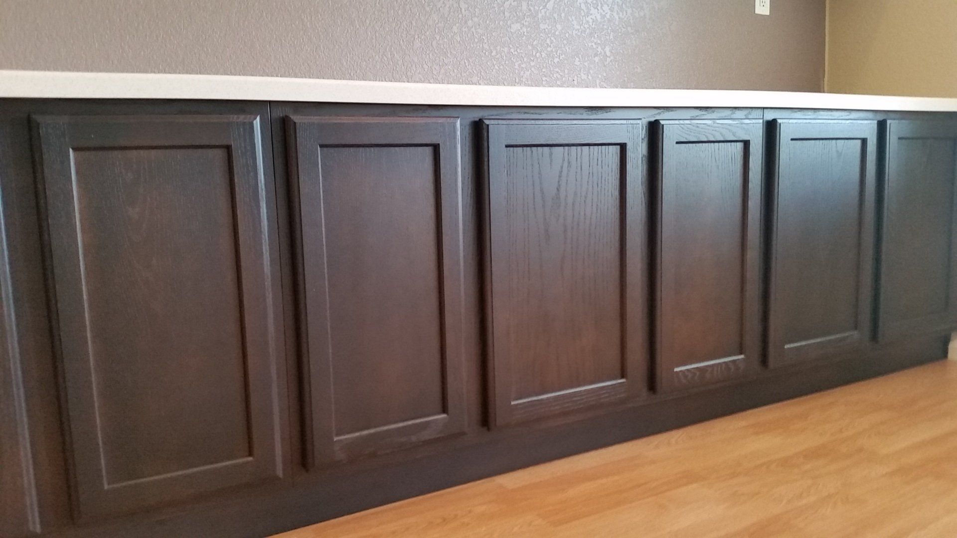 espresso finished cabinets in laundry