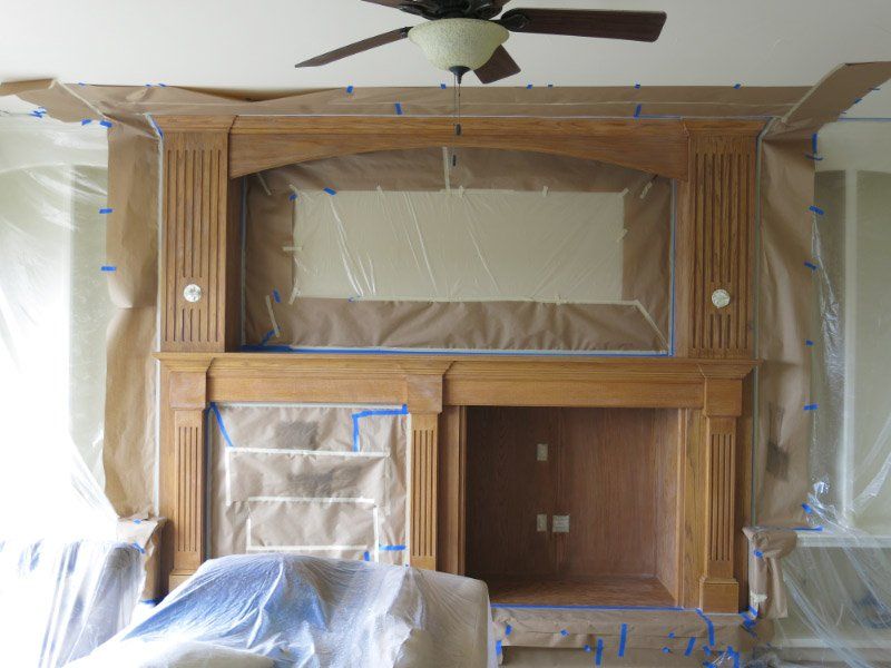masking process before painting fireplace mantel