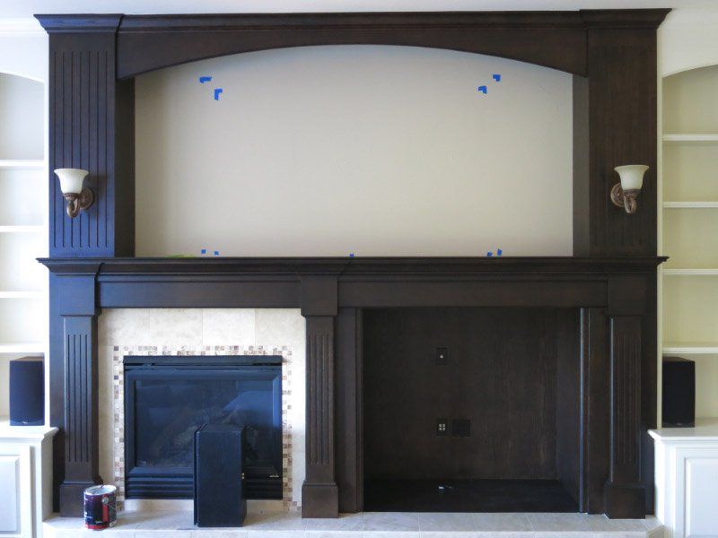 completed black painted fire place mantel