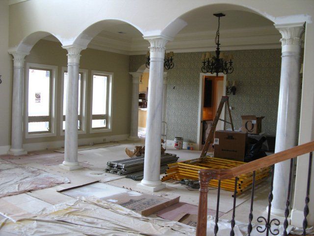 Painting in Process for faux marble pillars in living room