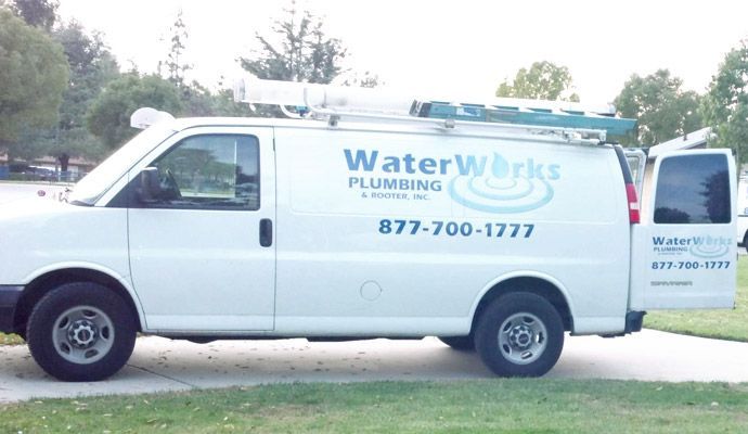 A white van with waterworks plumbing written on it