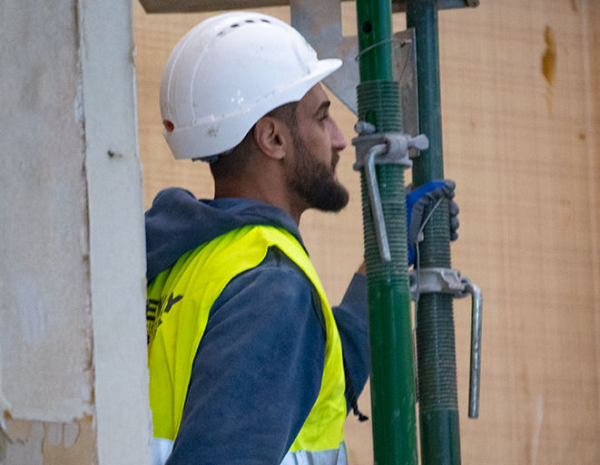 Greenway construction team member putting temporary works props in place.