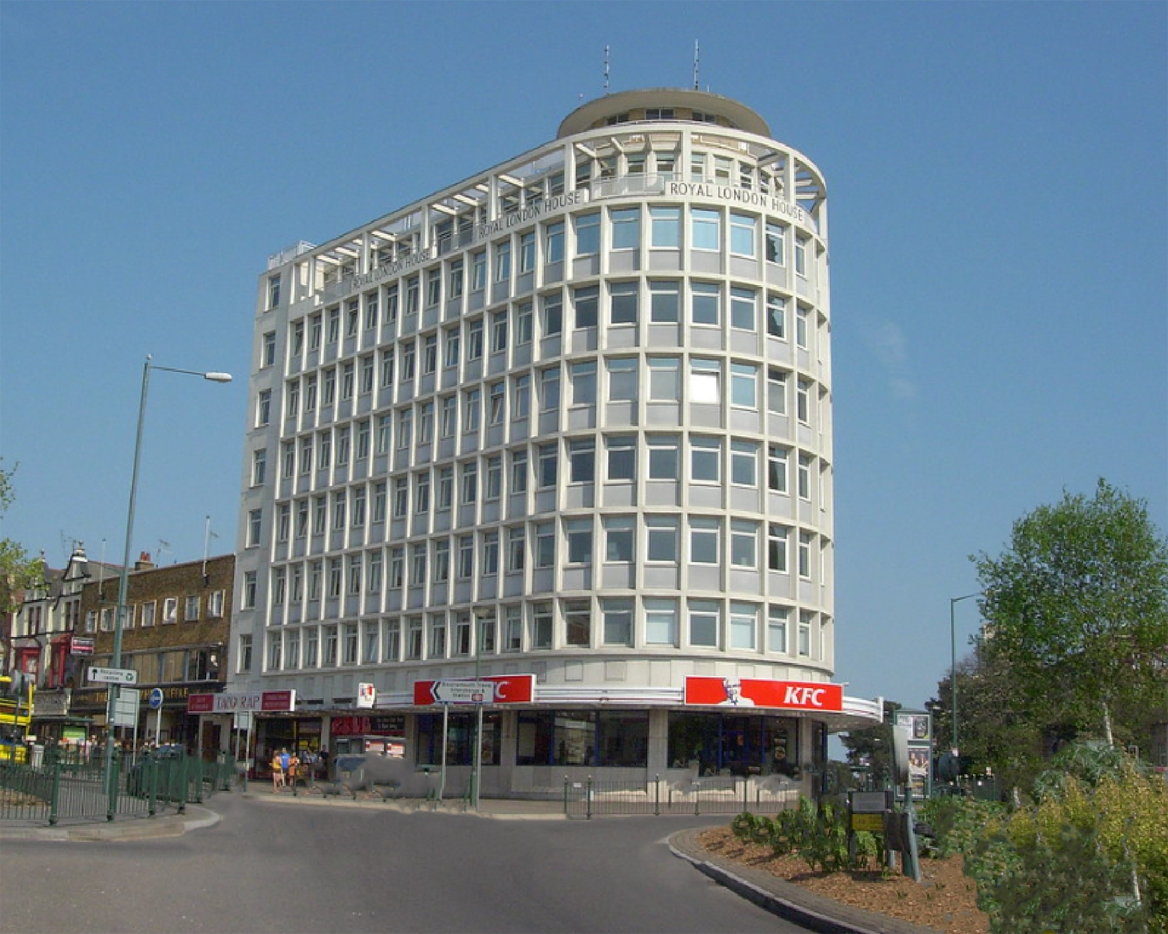 KFC Lansdown is at street level of The Royal London House. The building was erected in 1955 on the ruins of the old Metropole Hotel, severely damaged in a Luftwaffe bombing raid in 1943. It opened in 1958 and housed offices on its upper floors with various street-level shops.