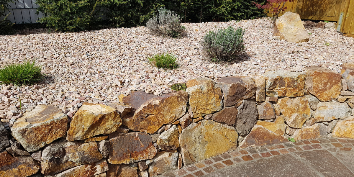 A garden transformed by creative hardscaping by Greenway Landscaping.