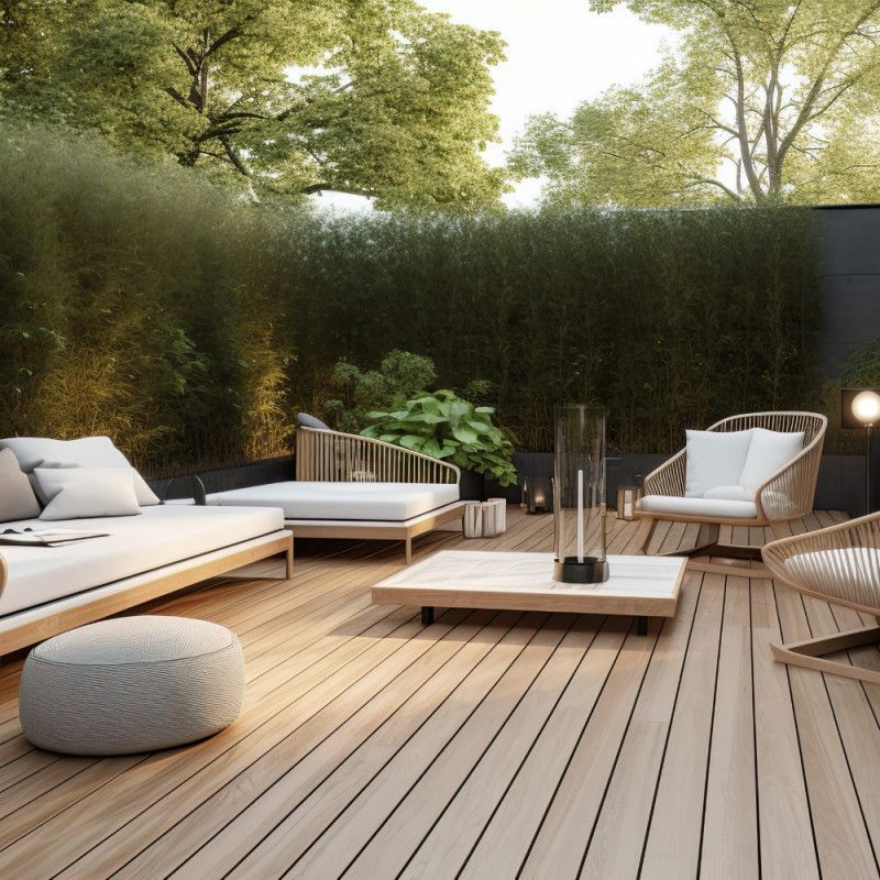 Modern light-toned composite decking with luxury outdoor furniture in a private garden.