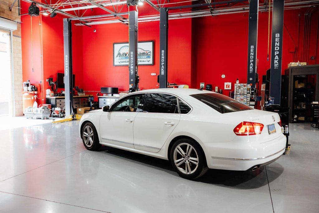White Sedan Parked Inside of Auto Shop | Auto Dynamic Services LLC