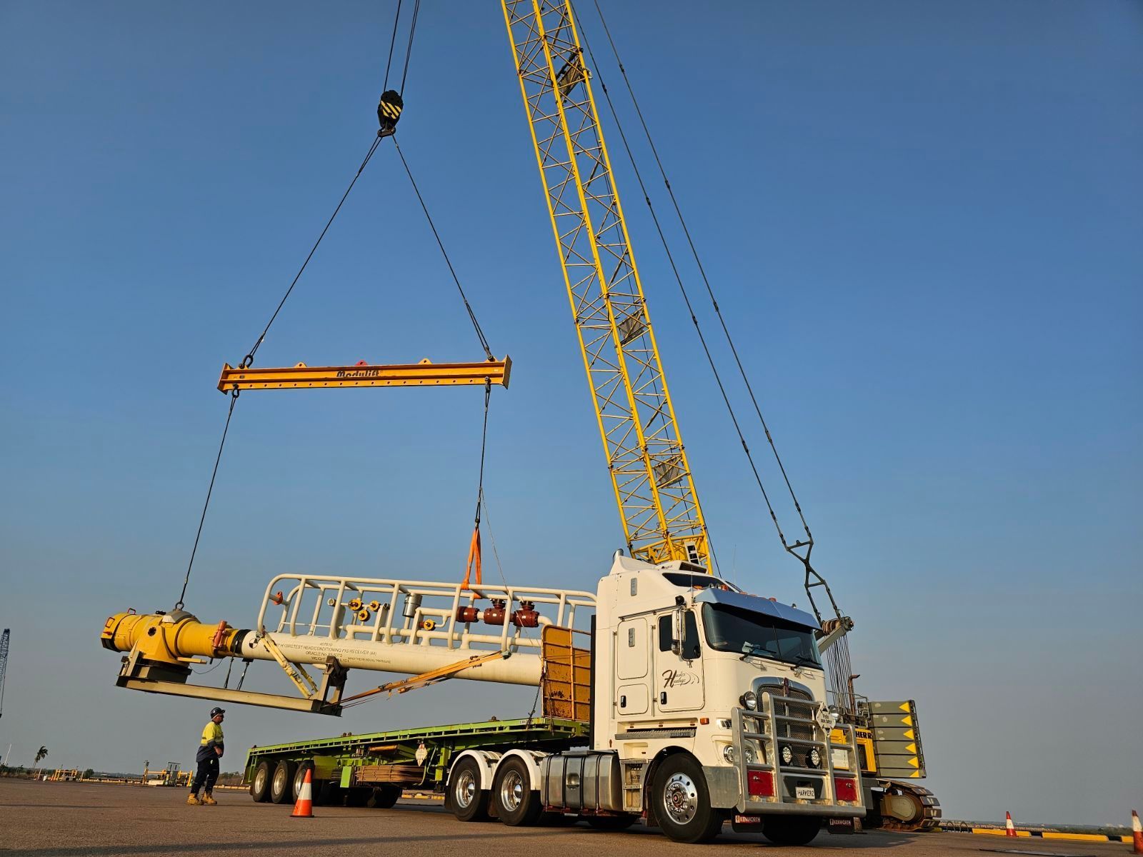 A White Semi Truck is Parked in a Puddle of Water — Harker Haulage In East Arm, NT