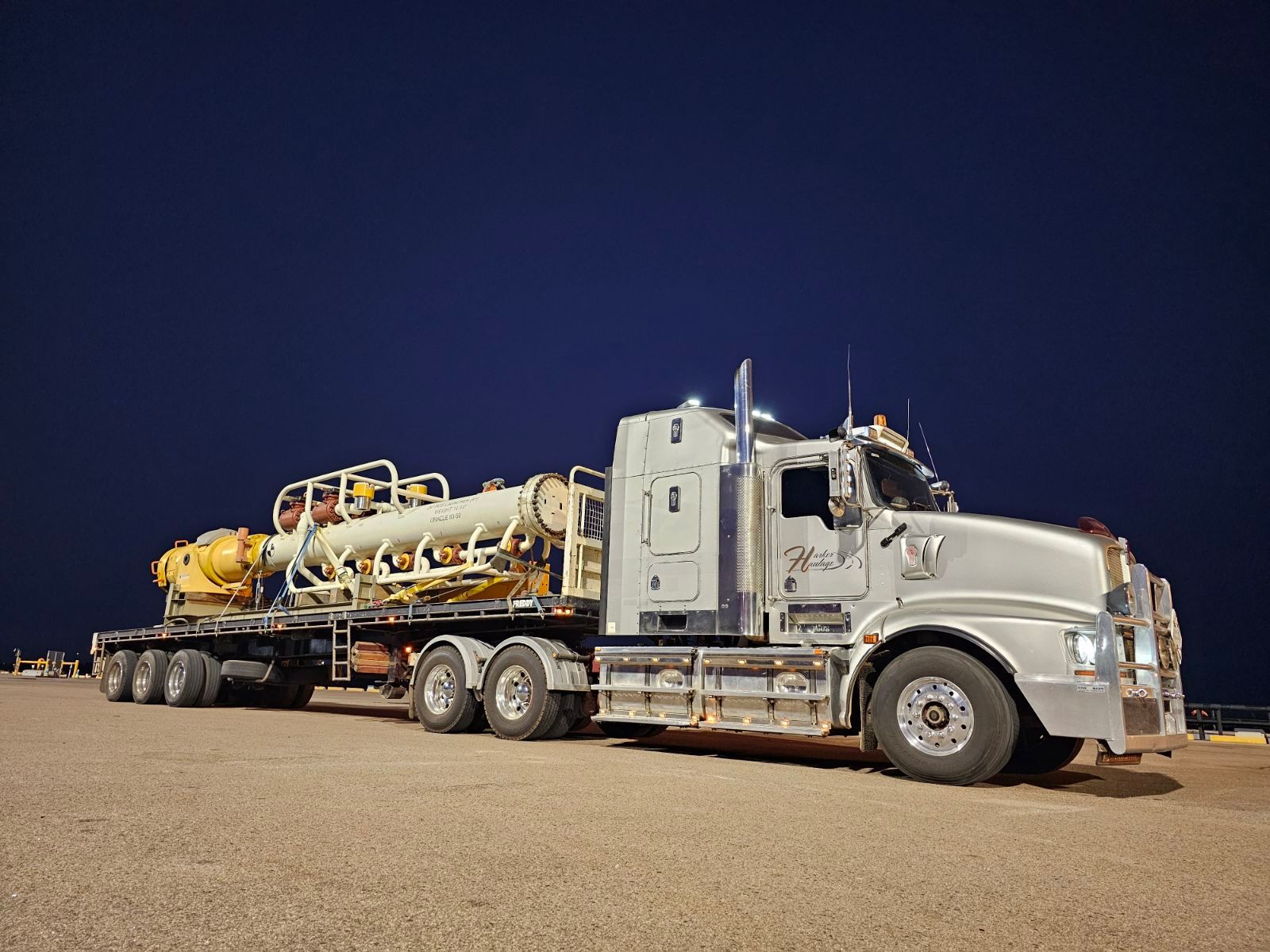 A Truck is Parked in a Field at Sunset — Harker Haulage In East Arm, NT
