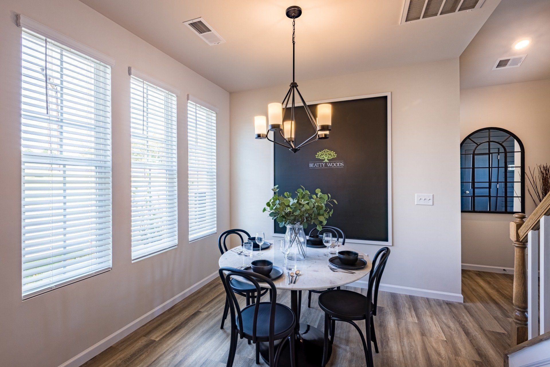 Dining area interior of Beatty Woods Townhomes, showcasing modern design and comfortable living space.