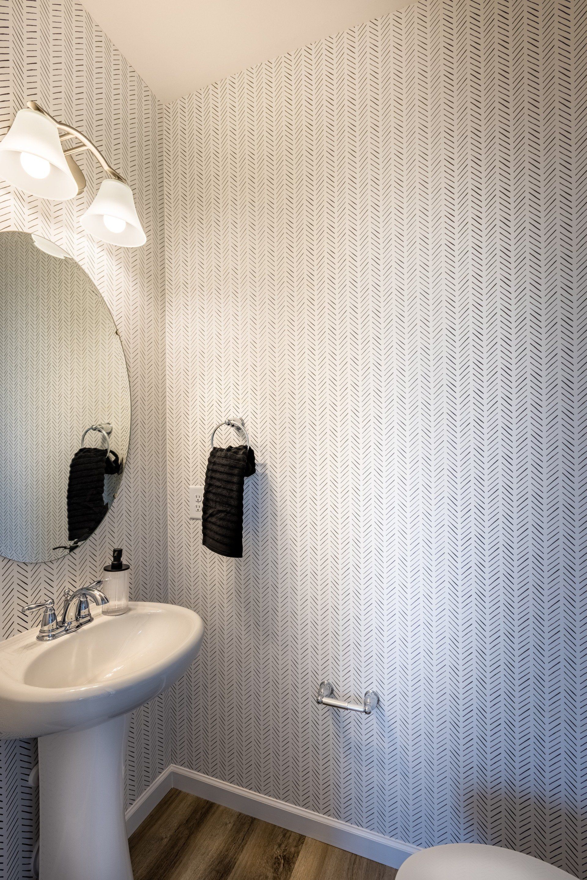 Close-up detail of stylish wallpaper design in Beatty Woods Townhomes bathroom.