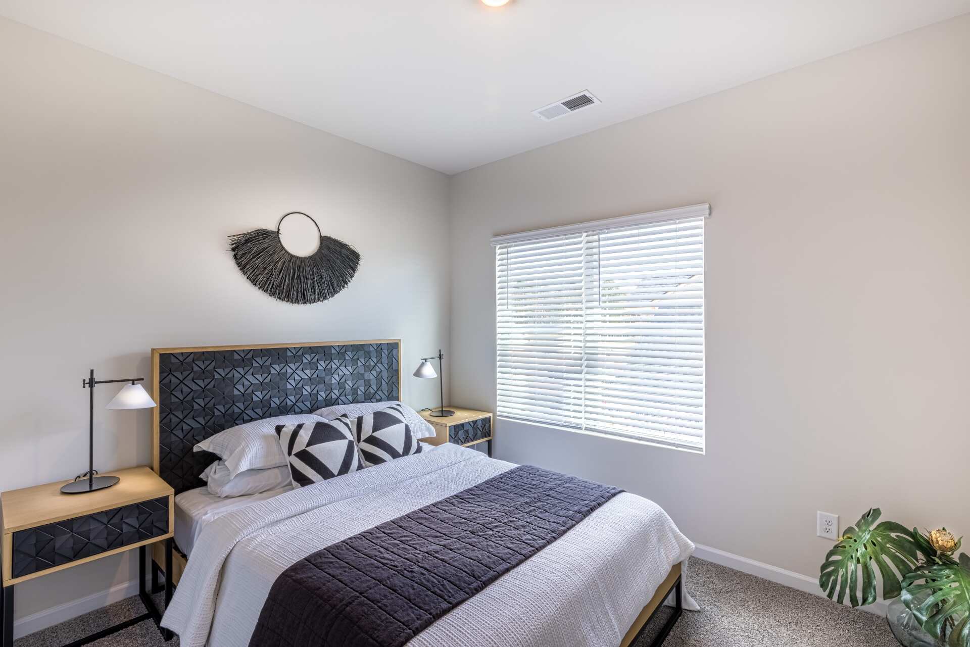 Spacious master bedroom in Beatty Woods Townhomes with natural light and contemporary design.