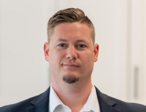 Headshot of Alex Harrison, Community Sales Manager at Brookline Homes, specializing in new home sales.