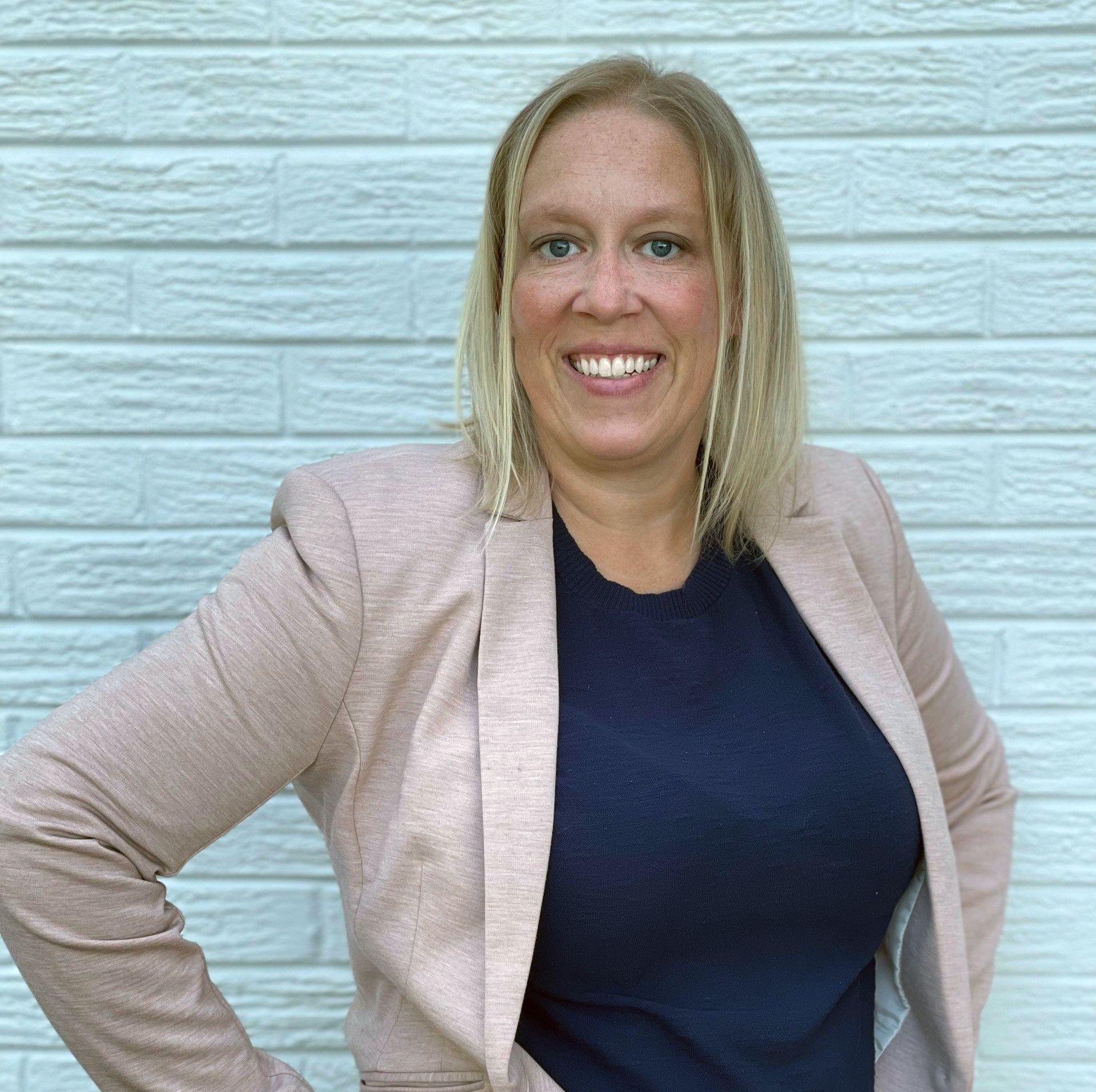 Headshot of Arianna Livermore, Controller at Brookline Homes, overseeing financial operations.