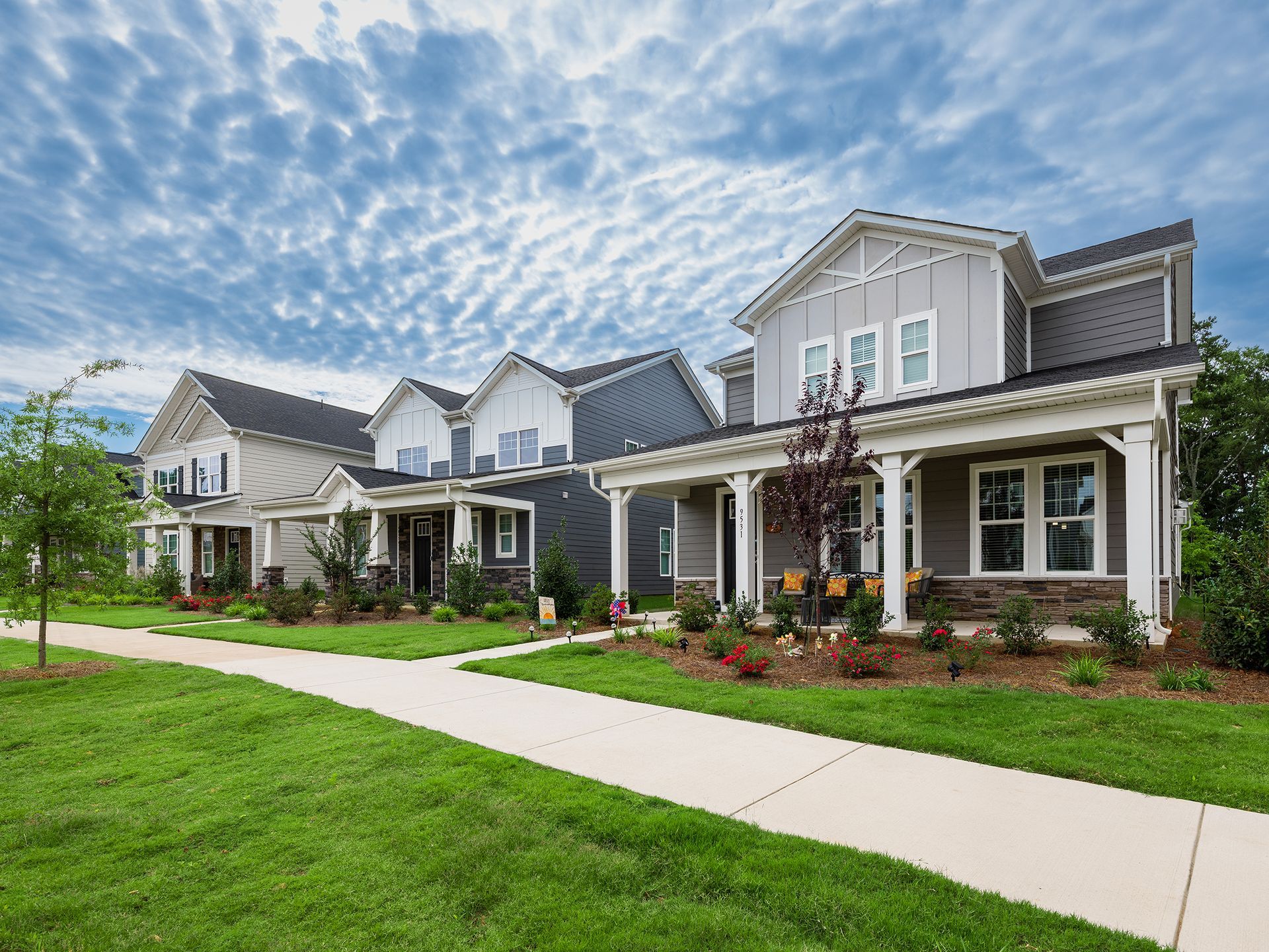 Streetscape of new single family homes in Edgewood Preserve by Brookline Homes