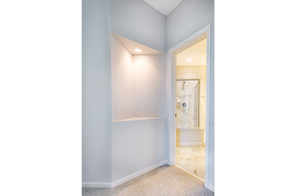 Hallway leading to the master suite in Water’s Edge Parkview Series with elegant design.