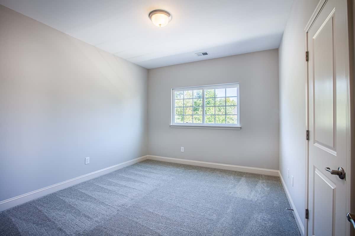 Another view of the second bedroom in Water’s Edge Parkview Series showcasing space and light.