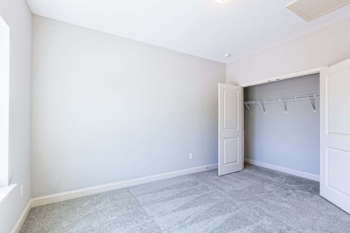 Third bedroom in Water’s Edge Parkview Series, versatile for guests or home office.