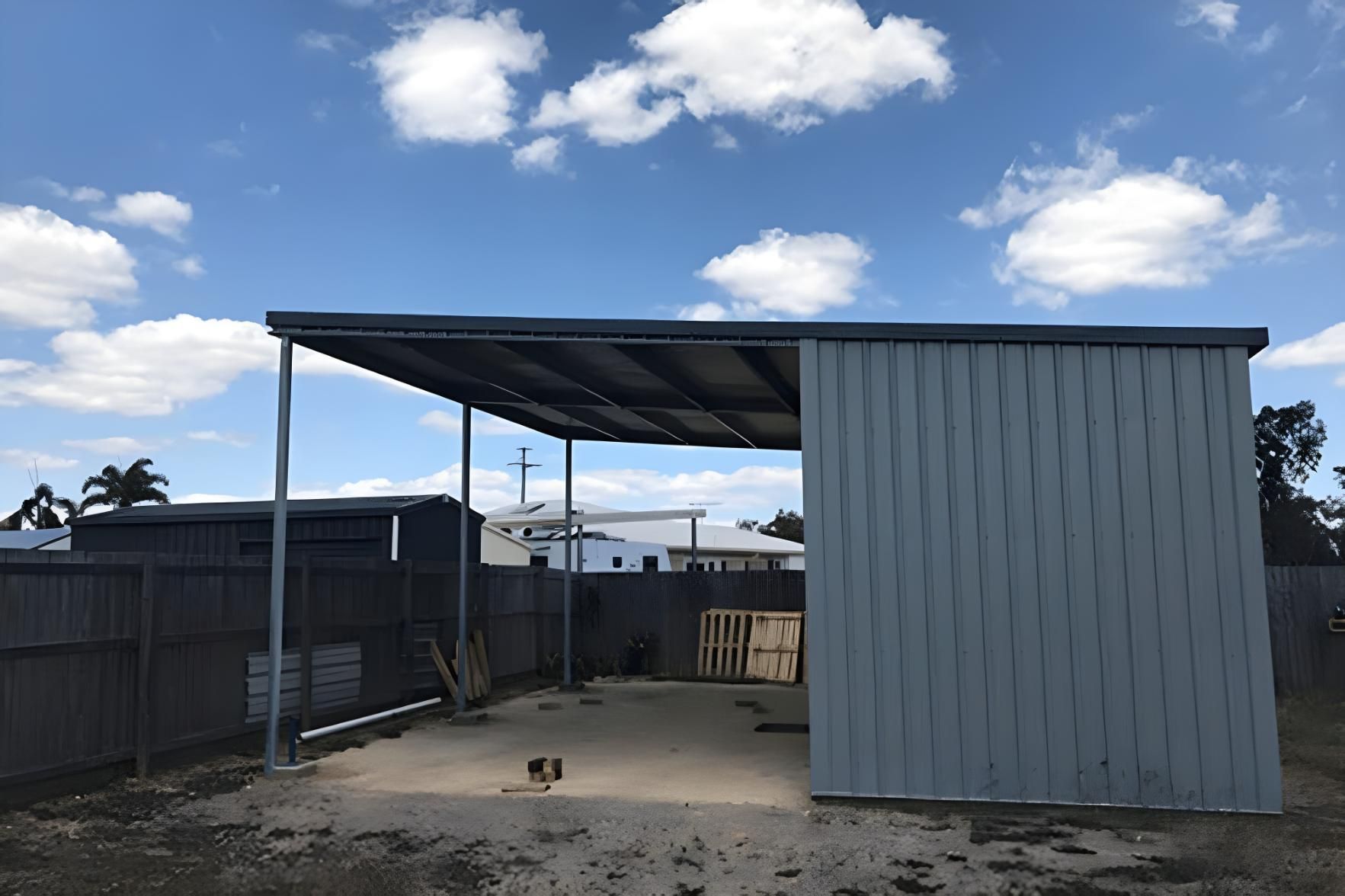 A Shed With A Blue Sky And Clouds In The Background — Dunnrite Mareeba Sheds & Garages In Mareeba, QLD
