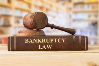 Debt Relief Agency — Bankruptcy Book Under Wooden Gavel in Lakeland, FL
