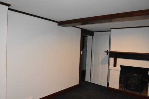 Living Room with a Fireplace & White Walls — Derwent Park, TAS — Allen Built 