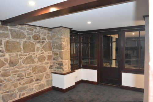 Living Room with Stone Wall — Derwent Park, TAS — Allen Built 