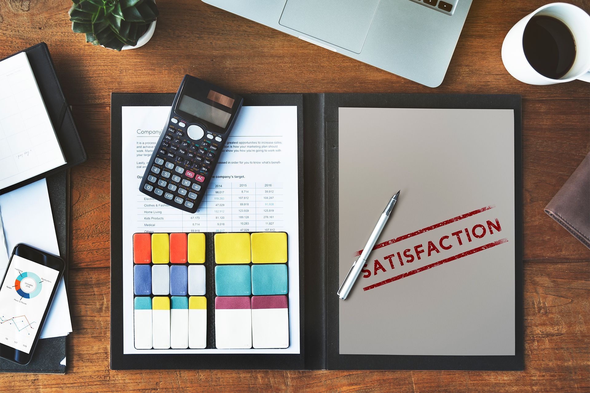 Business workspace with documents and calculator.