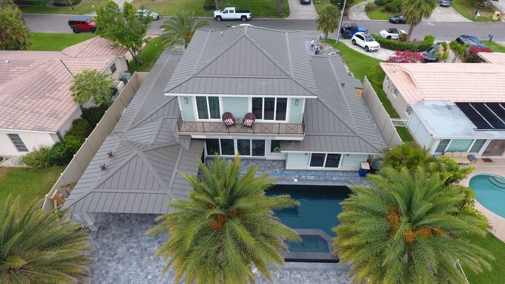 A kitchen with a large island and stools