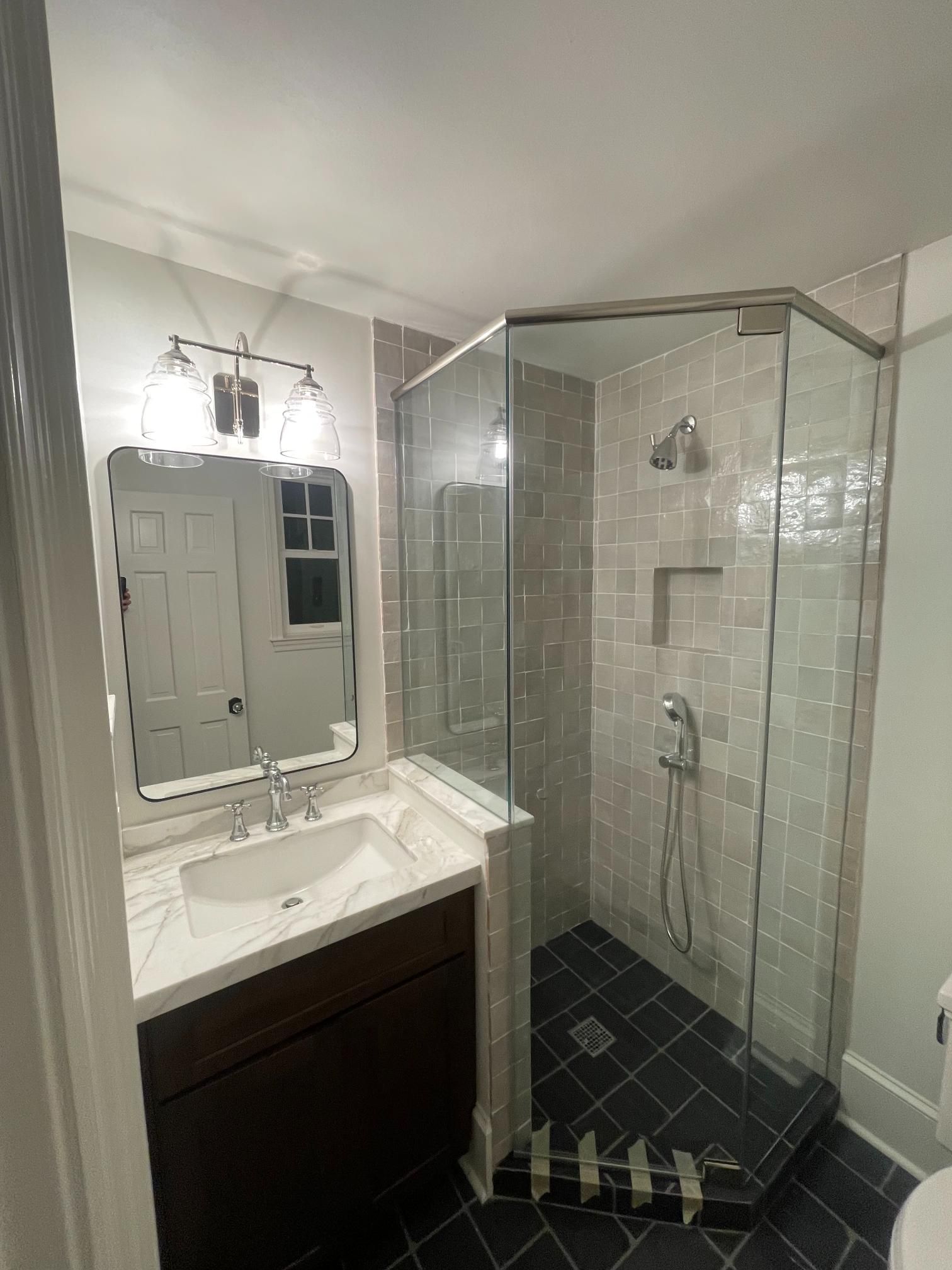 A large house with three garages and a driveway