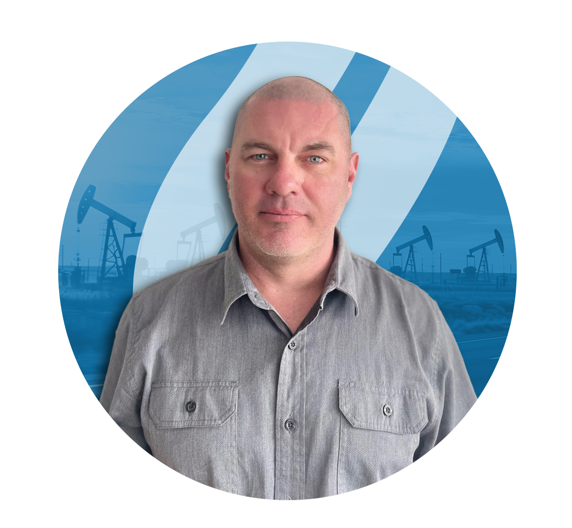 Man in grey shirt; oil derricks in background, blue circle.