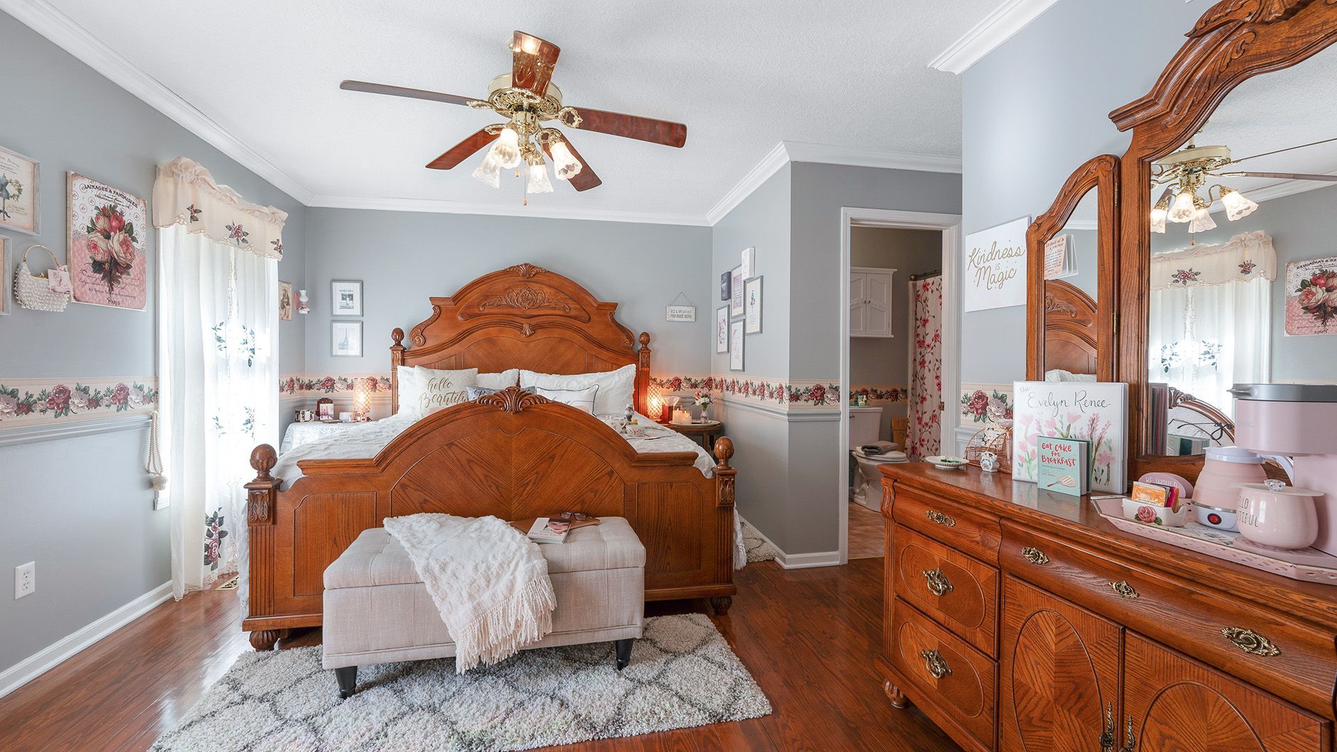 a bedroom with a wooden bed and a dresser