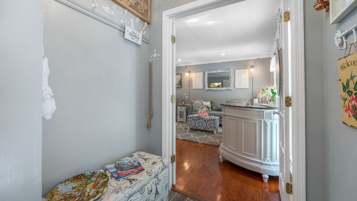 entry hallway with a welcome sign on the wall