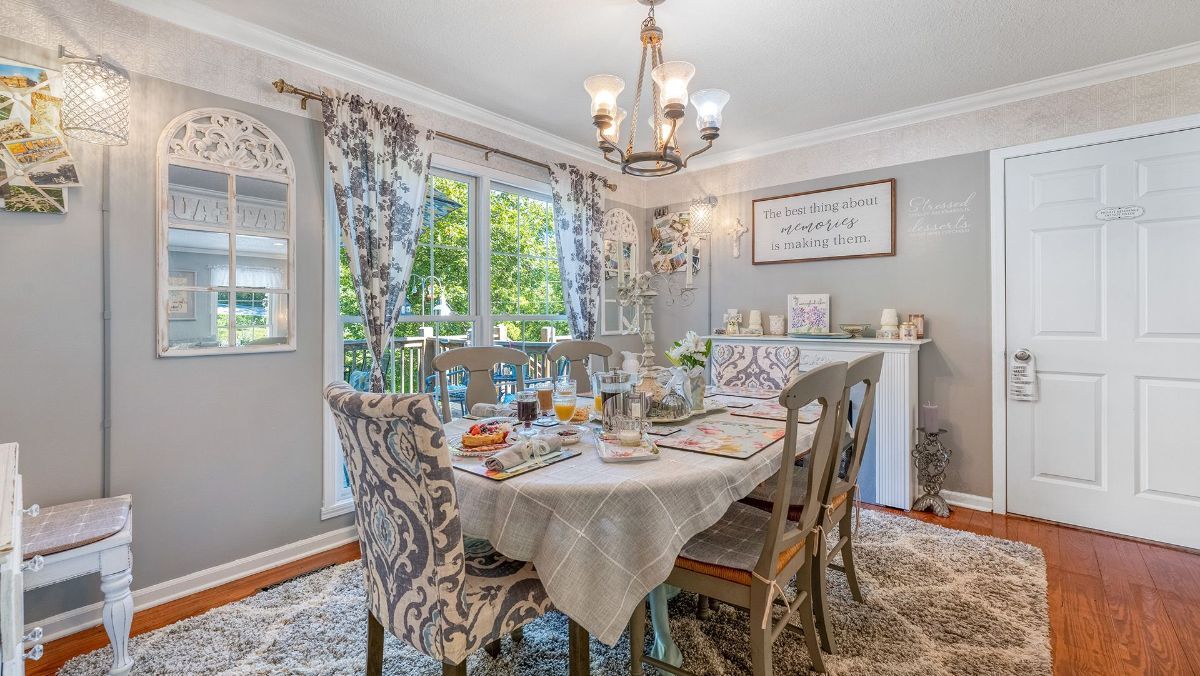 a dining room with a sign on the wall that says